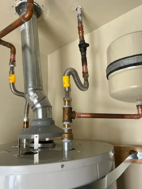 Water heater installation and plumbing repair in DeWeese